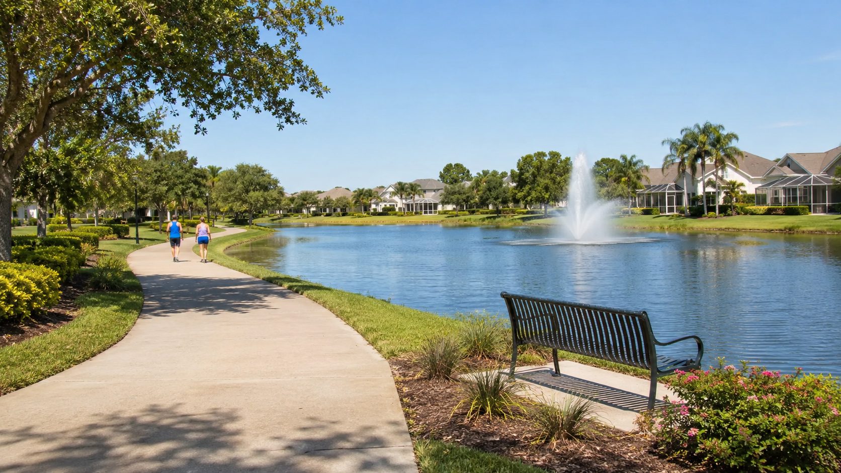 Lake, fountain, and walking path at Meadowbrook Estates